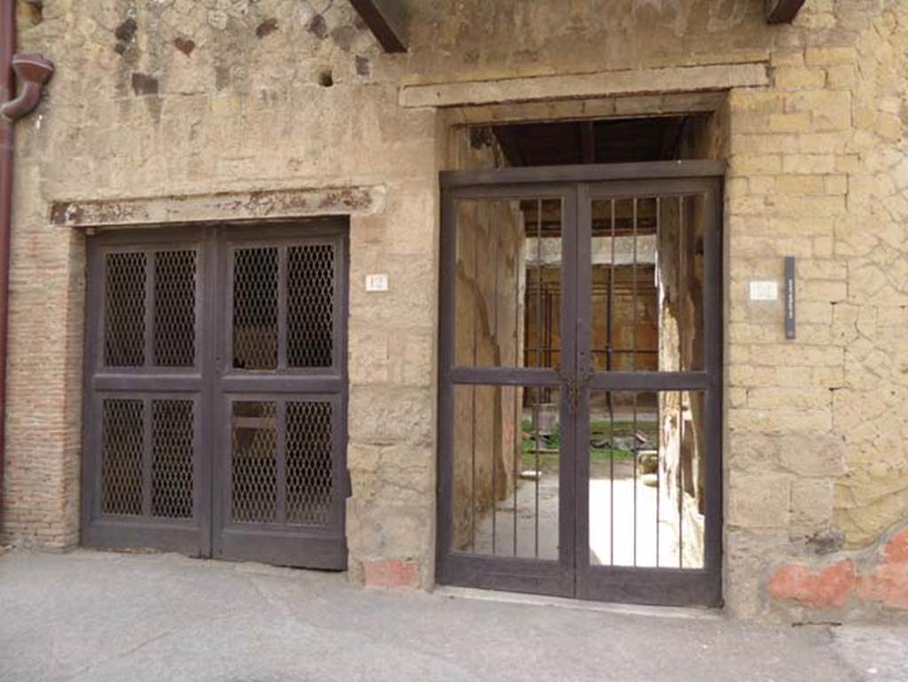 V 12 doorway on left, and V.11, House of Apollo the Lyre-Player, on right. October 2014. Looking south to entrance doorways. Photo courtesy of Michael Binns.